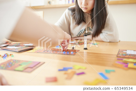 Family playing board games 65349534