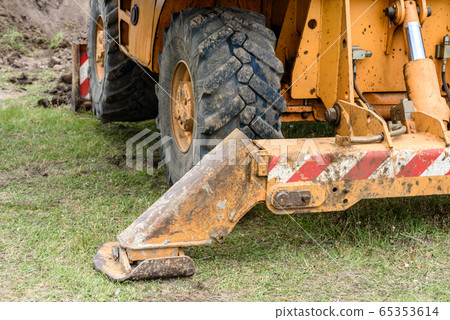 The modern excavator performs excavation work The modern excavator performs excavation work 65353614