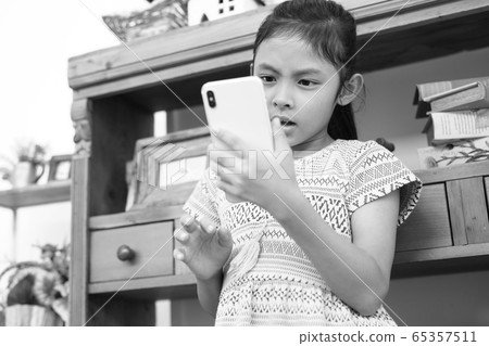 Child image of operating smartphone 65357511