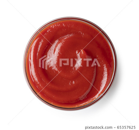 Ketchup in a glass bowl placed on a white background 65357625