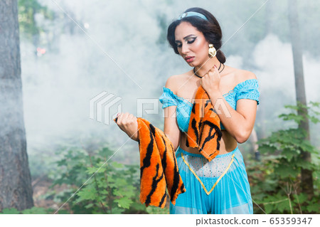 Stop animal killing concept - Pretty girl show animal skin that she wants to tell someone don't kill animals or stopped violence against animal. 65359347