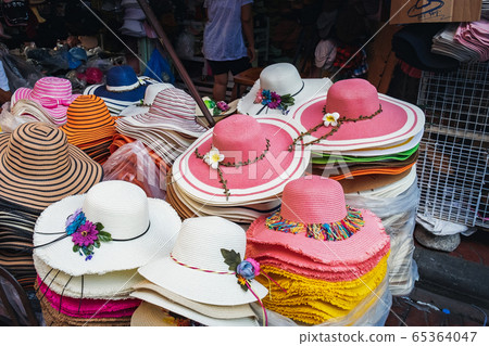 Pile of hats in Thai outdoor flea market 65364047