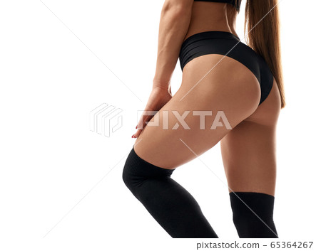 Crop of fit female buttocks. Crop of fit female buttocks. 65364267