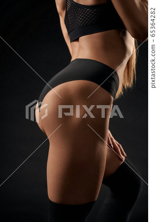 Crop of fit female buttocks. Crop of fit female buttocks. 65364282