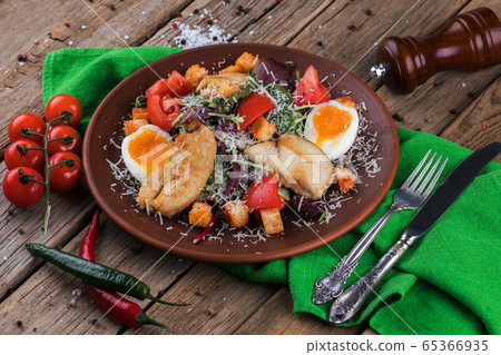 Fresh vegetable salad served with fried meat Fresh vegetable salad served with fried meat 65366935