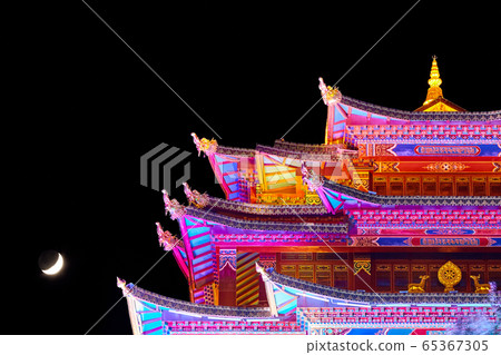 Illuminated Guishan Temple of Tibetan Buddhism at night. 65367305