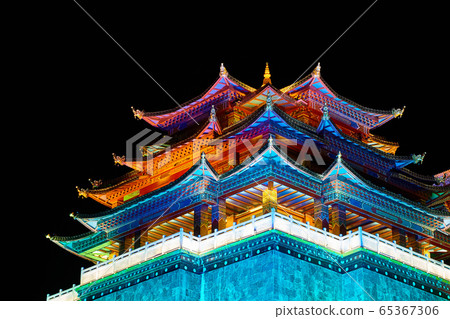 Illuminated Guishan Temple of Tibetan Buddhism at night. Illuminated Guishan Temple of Tibetan Buddhism at night. 65367306