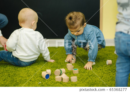 Children in preschool play with cubes. Happy litle children 65368277