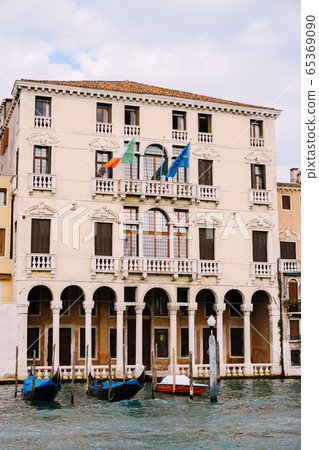 Old houses on Grand Canal, Venice, Italy. Vintage hotels and residential buildings in the Venice center. Historical architecture of Venice on water in summer. Venetian street with ancient facades. Old houses on Grand Canal, Venice, Italy. Vintage hotels and residential buildings in the Venice center. Historical architecture of Venice on water in summer. Venetian street with ancient facades. 65369090