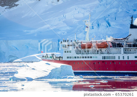 Red cruise passenger liner drifting among the Red cruise passenger liner drifting among the 65370261