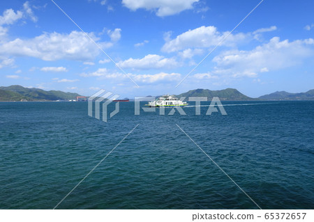 Ferry heading to the pier on Okunoshima Ferry heading to the pier on Okunoshima 65372657