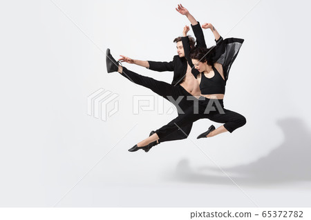 Young and graceful ballet dancers in minimal black style isolated on white studio background Young and graceful ballet dancers in minimal black style isolated on white studio background 65372782