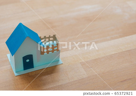A blue house with copy space.Home loan ,mortgage or refinance concept.Cottage icon. A blue house with copy space.Home loan ,mortgage or refinance concept.Cottage icon. 65372921