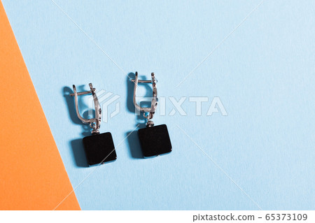 Top view of fashion jewelry and accessories on bright color background. Luxurious jewelry bijouterie and trendy concept. 65373109