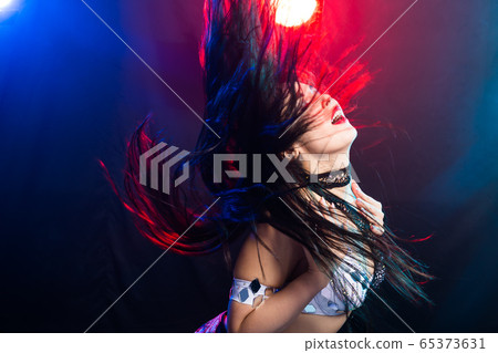 Portrait of a woman in oriental costume performing belly dance. Tribal fusion dance concept. 65373631