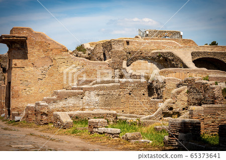 Ancient Roman buildings in Ostia Antica Archeological Site - Rome Italy 65373641