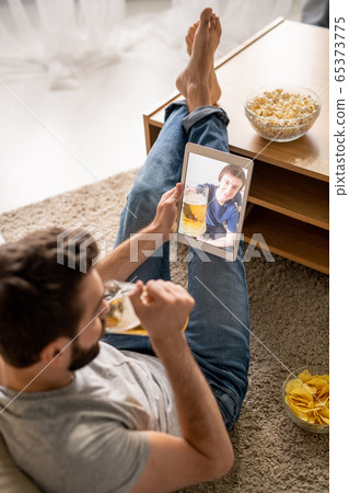 Toasting with friend via telecommunication app 65373775