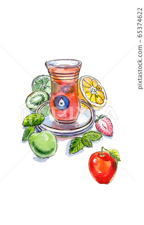 Turkish apple tea in traditional glass cup with fresh fruit and lemon balm 65374622