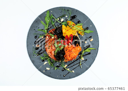 Hawaiian salmon fish poke bowl with rice, radish,cucumber, tomato, sesame seeds and seaweeds. Buddha bowl. Diet food Hawaiian salmon fish poke bowl with rice, radish,cucumber, tomato, sesame seeds and seaweeds. Buddha bowl. Diet food 65377461