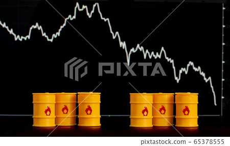barrels of oil and gasoline on the background of a 65378555