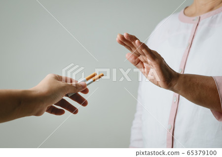 Quit smoking, no tobacco day, mother hands gesture reject proposal the cigarette 65379100