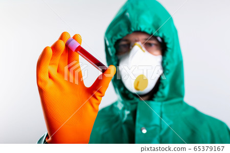 Test tube with blood sample in hand of Coronavirus specialist Test tube with blood sample in hand of Coronavirus specialist 65379167