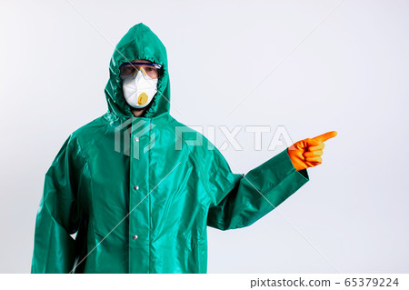 Protected against COVID-19 man pointing to the right stock photo Protected against COVID-19 man pointing to the right stock photo 65379224