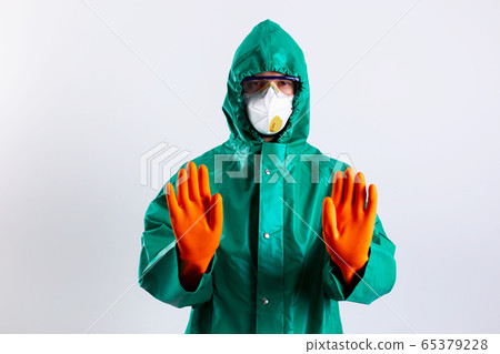 Disinfectant worker not allowing people to come close stock photo Disinfectant worker not allowing people to come close stock photo 65379228