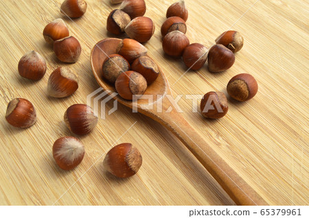 Fresh tasty organic hazelnut filbert, on wooden Fresh tasty organic hazelnut filbert, on wooden 65379961