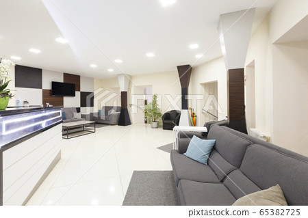Entrance to the private dentistry, the waiting area and wall with big tv 65382725