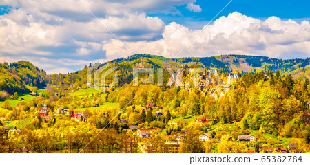 Ruins of Vranov Castle with small rock chapel, aka Pantheon, in Mala Skala on sunny summer day with blue sky and lush green trees, Bohemian Paradise, aka Cesky Raj, Czech Republic 65382784