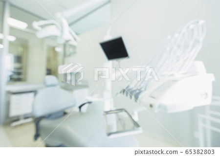 Blurred dentistry room with modern equipment for making operations 65382803