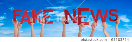 People Hands Holding Word Fake News, Blue Sky People Hands Holding Word Fake News, Blue Sky 65383724