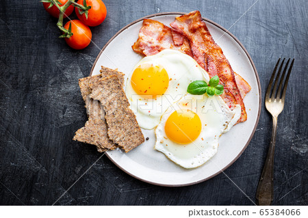 Fried eggs and bacon Fried eggs and bacon 65384066