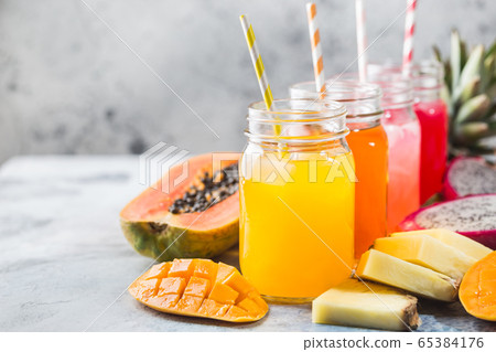Glasses of tropical juices 65384176
