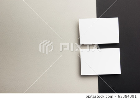 Business card blank on wooden background. Corporate Stationery, Branding Mock-up. Creative designer desk. Flat lay. Copy space for text 65384391