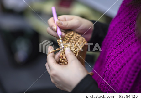 Knitting, sewing, or making nails 65384429