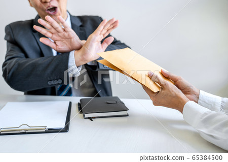 Anti Bribery and corruption concept, bribe in the 65384500