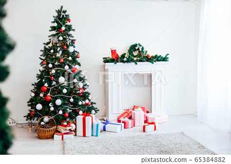 Christmas tree with Garland decoration and gifts for the new year Christmas tree with Garland decoration and gifts for the new year 65384882