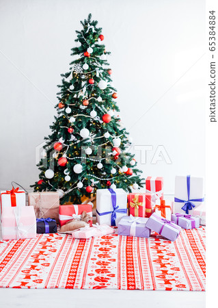 Christmas home decor with Christmas tree and gifts for the new year Christmas home decor with Christmas tree and gifts for the new year 65384884