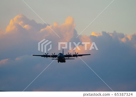 C-130 Hercules flying in the dusk C-130 Hercules flying in the dusk 65387324
