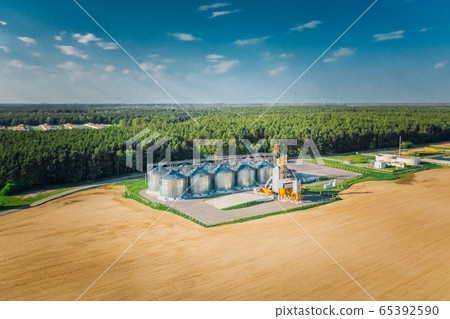 Modern grain elevator in the fields of agriculture Modern grain elevator in the fields of agriculture 65392590