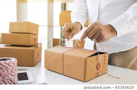 Young asian teenage product owners are packing 65393628