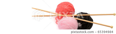 Balls of wool and knitting needles isolated on Balls of wool and knitting needles isolated on 65394984