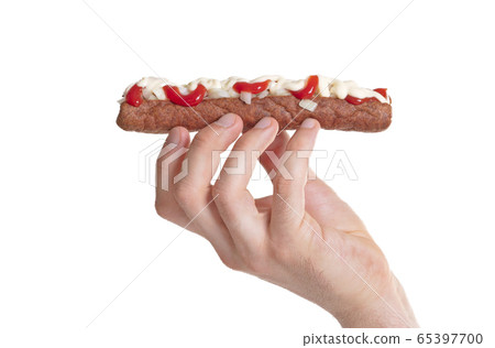 One frikadel with ketchup, mayonnaise on chopped 65397700