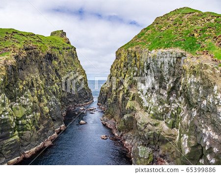Narrow space of ocean between two islets Narrow space of ocean between two islets 65399886