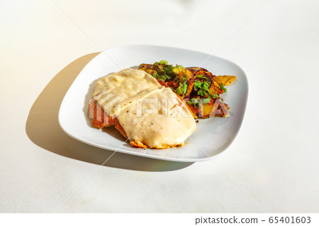 Cheese escalope with fried potatoes Cheese escalope with fried potatoes 65401603