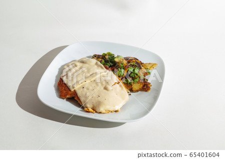 Cheese escalope with fried potatoes Cheese escalope with fried potatoes 65401604