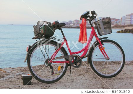 Red bicycle by the sea in the town of Pomorie Red bicycle by the sea in the town of Pomorie 65401840