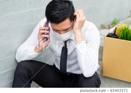 Asian man being fired Asian man being fired 65403371